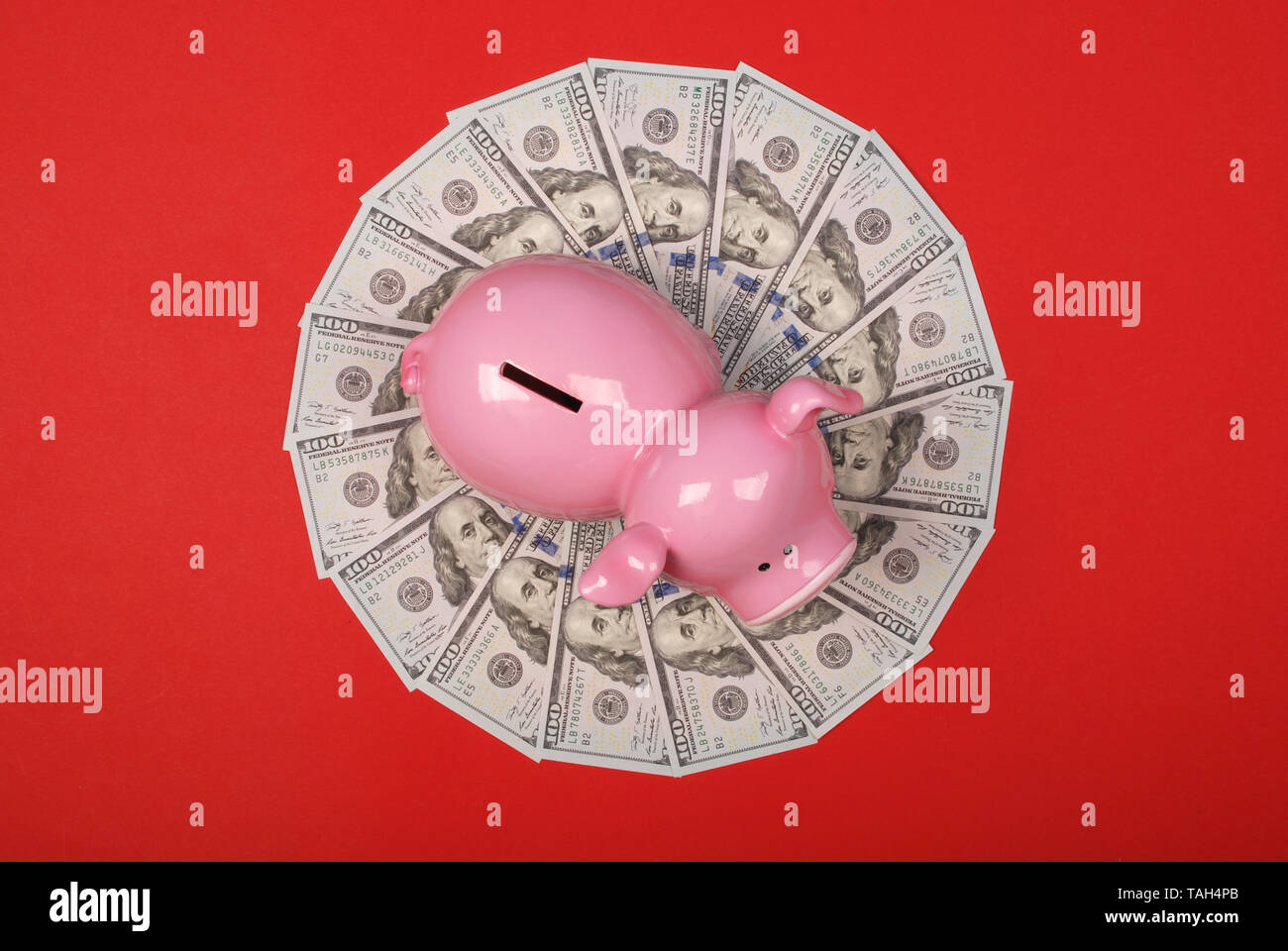 Piggy bank on mandala kaleidoscope from money. Abstract money background raster pattern repeat mandala circle. Stock Photo