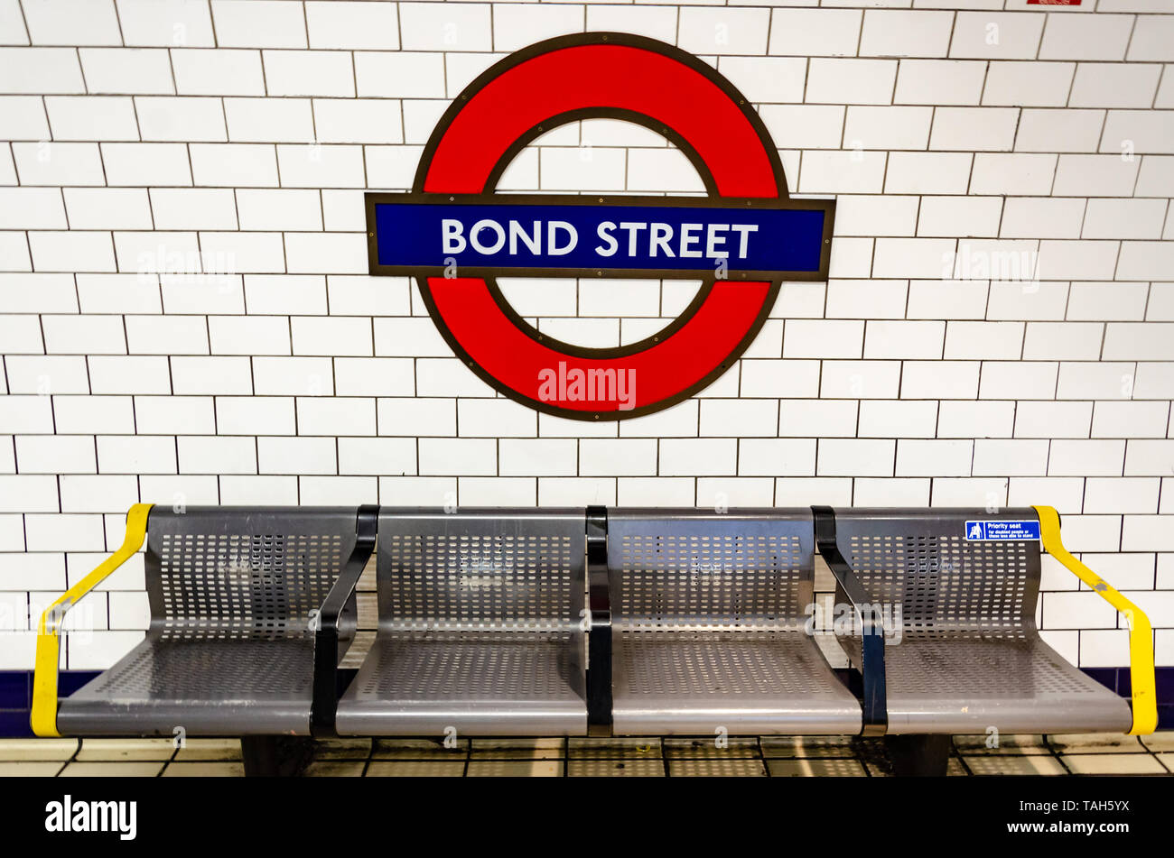 A metal bench on the platform at Bank London Underground Railway Station. Stock Photo