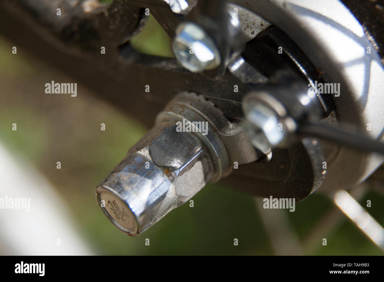 metal nut on the rear wheel of the bike Stock Photo Alamy