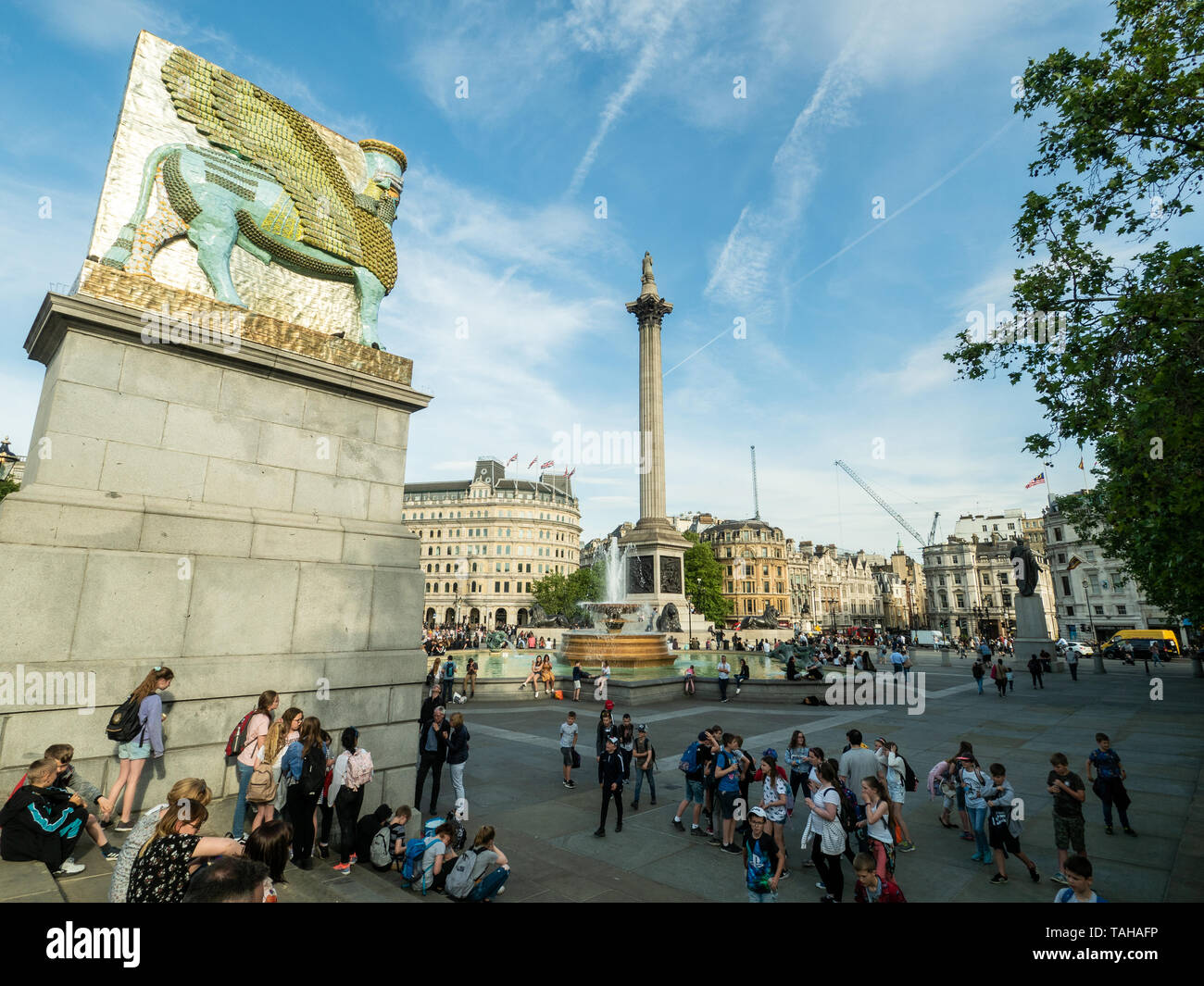 Trafalgar Sq. London. On the left is a recreaton of the Lamassu (Winged Bull) by artist Michael Rakowitz made from 10,500 empty Iraqi date syrup cans. Stock Photo