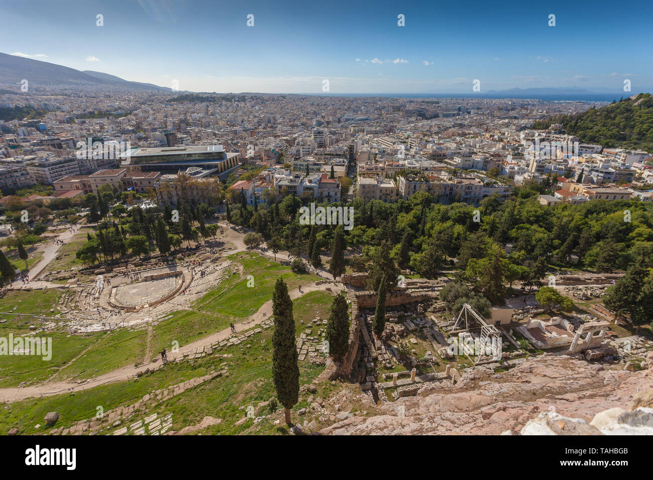 Panorama of the Theater of Dionisio and Asclepio Sanctuary with the city of Athens in the background, Greece Stock Photo