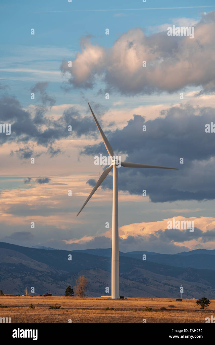 Wind turbine against a background of cloudy sky Stock Photo - Alamy
