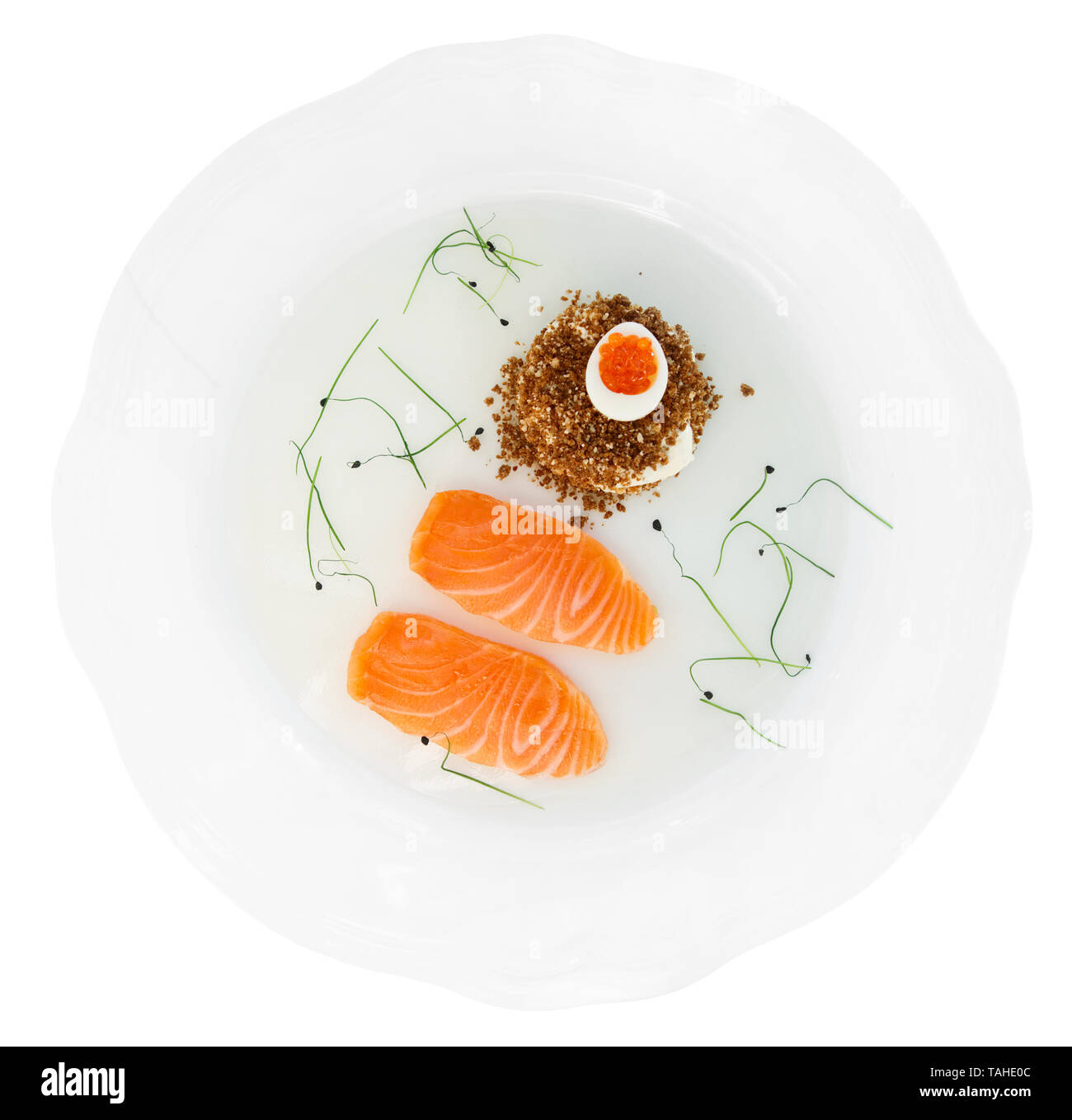 Salmon fillet with bread and caviar in plate isolated on white with ...
