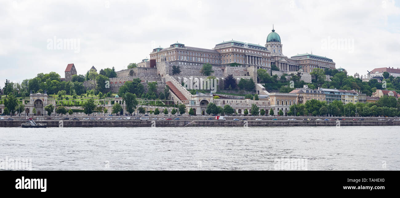 Budapest Buda castle or Royal Palace on top of castle hill with the river Danube in the foreground Hungary Stock Photo