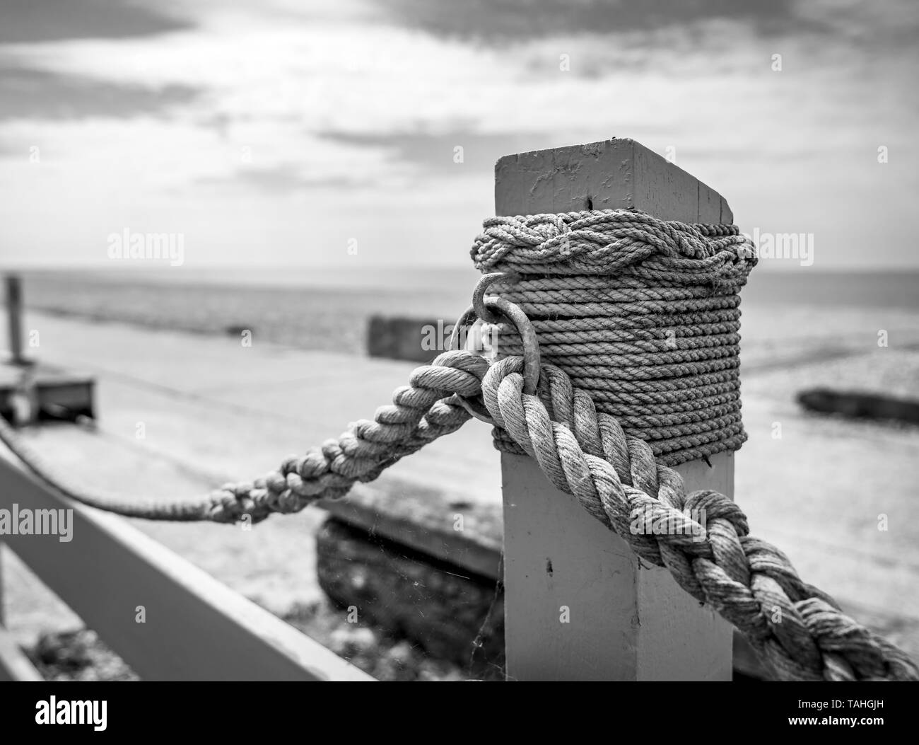 braided rope fence and post Stock Photo