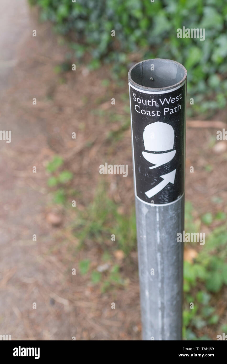 Route marker post for Cornwall section of the long-distance South West Coast Path. Stock Photo