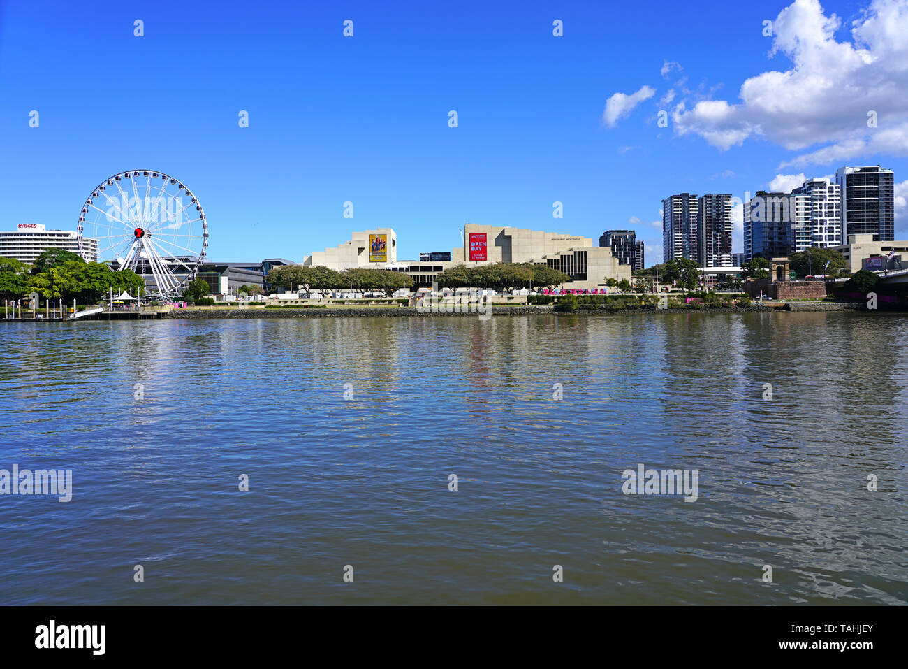 BRISBANE, AUSTRALIA -23 JUL 2018- Waterfront view of the Wheel of Brisbane Ferris Wheel and the QPAC near the South Bank Parklands, City of Brisbane,  Stock Photo