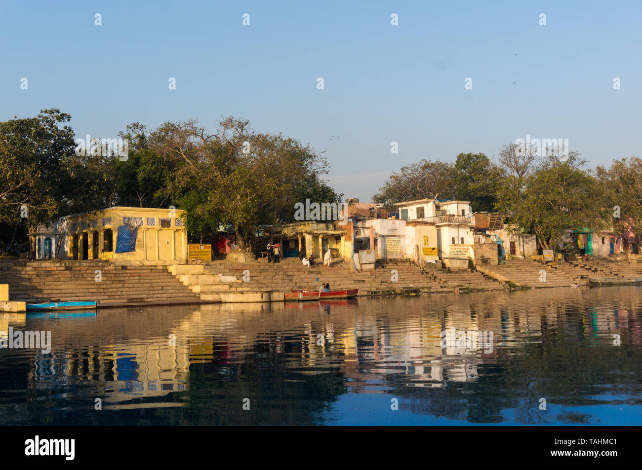 Delhi, India - circa 2019: Yellow temples and hindu buildings on the yamuna ghat bank in Delhi. This ghat near kashmiri gate is a popular tourist plac Stock Photo