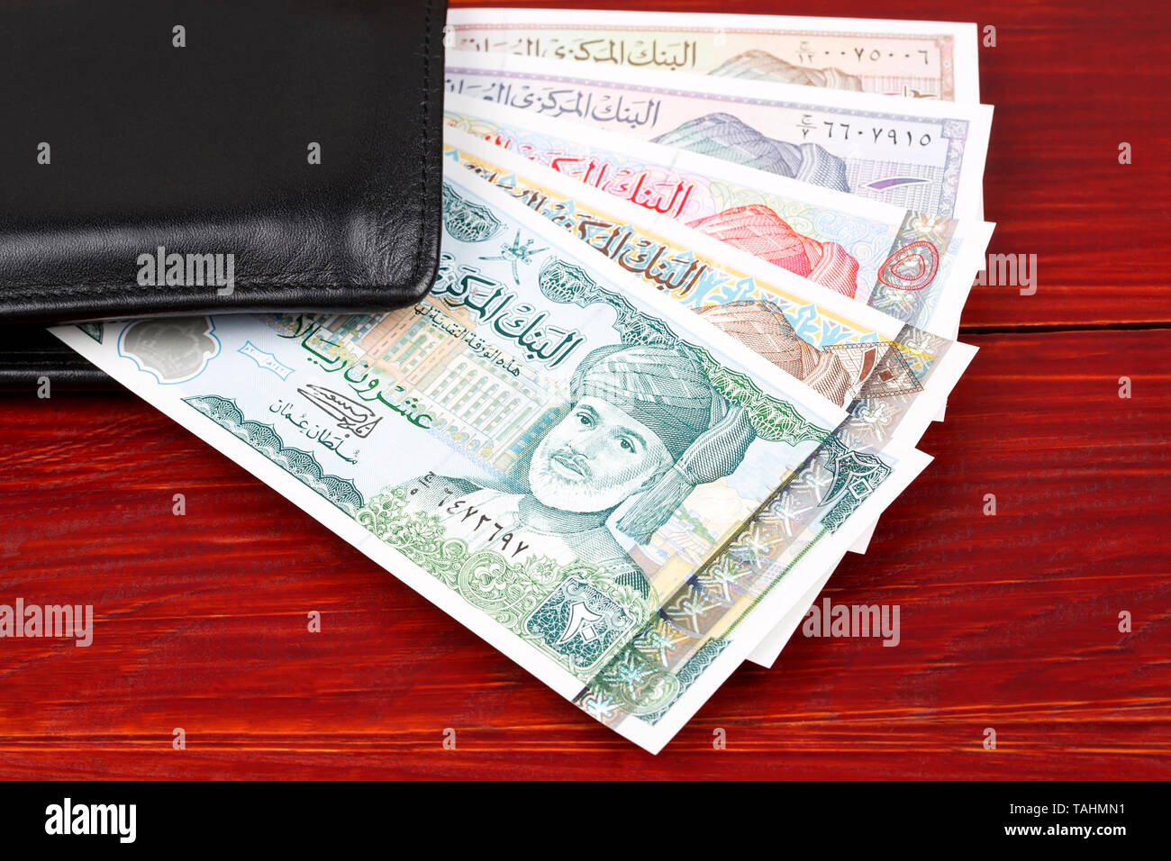 Louis Vuitton wallet filled with cash Stock Photo - Alamy