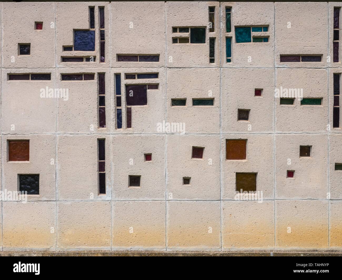 Colorful glass brick windows on a concrete wall on the El Salvador