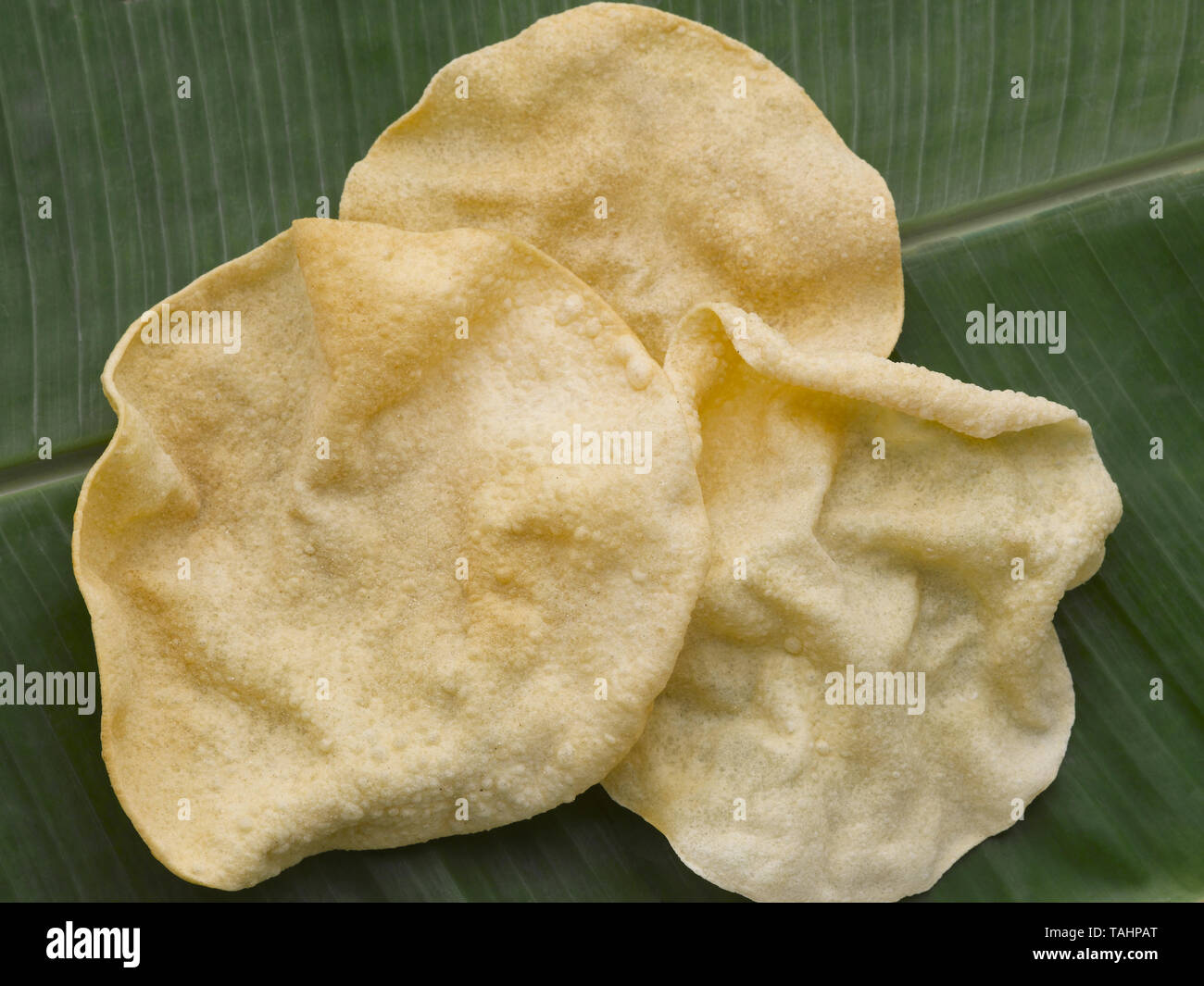 PAPPADDAM- SERVED IN A  TRADITIONAL TAMIL LUNCH ON  A GREEN PLANTAIN LEAF Stock Photo