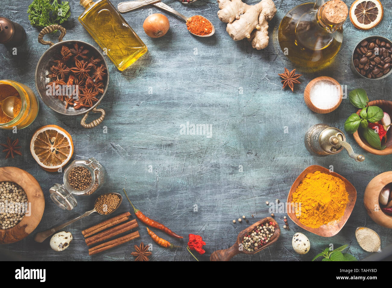 Various herbs and spices on gray grunge background Stock Photo