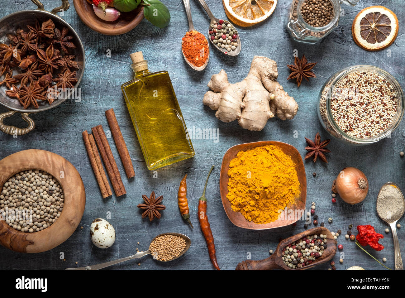Various herbs and spices on gray grunge background Stock Photo