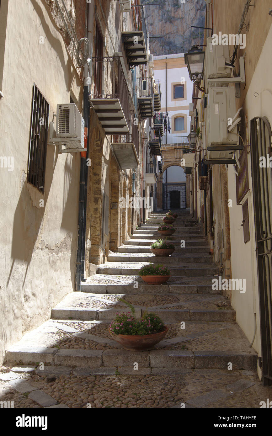 Narrow street in Cefalu, Sicily Stock Photo