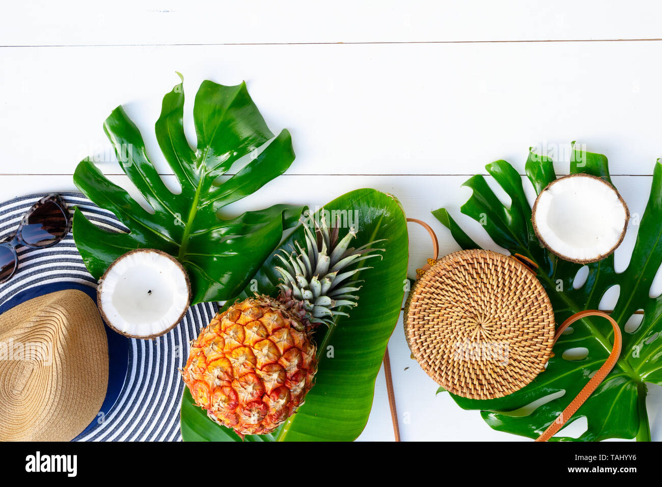 Summer Flat Lay Scenery With Hat Bag Leaves And Fruits On White