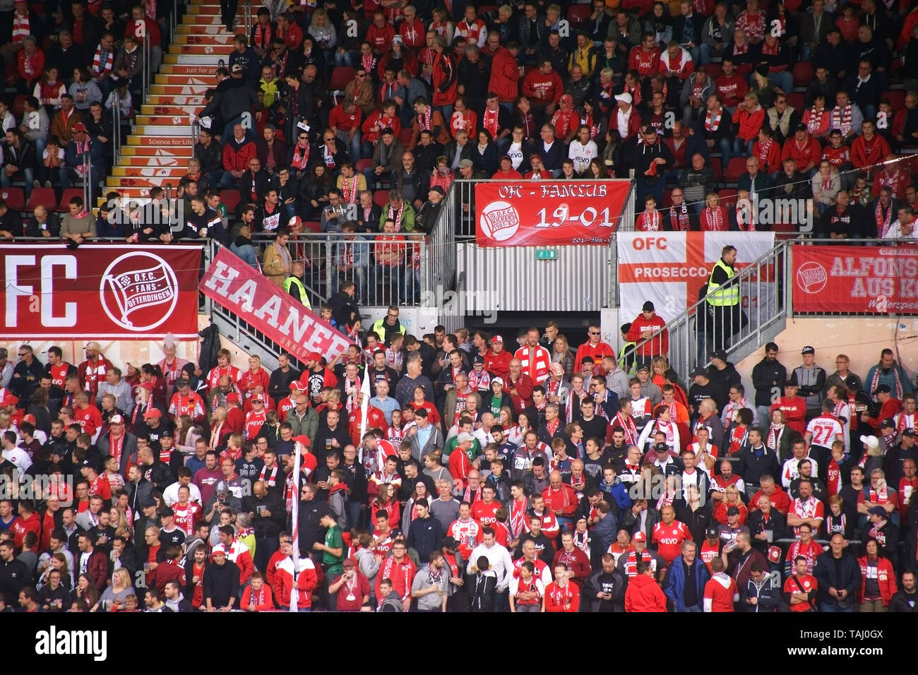 Mainz, Germany - September 16, 2017: Football fans of the football club Offenbacher Kickers are standing close to each other in the guest gallery on S Stock Photo