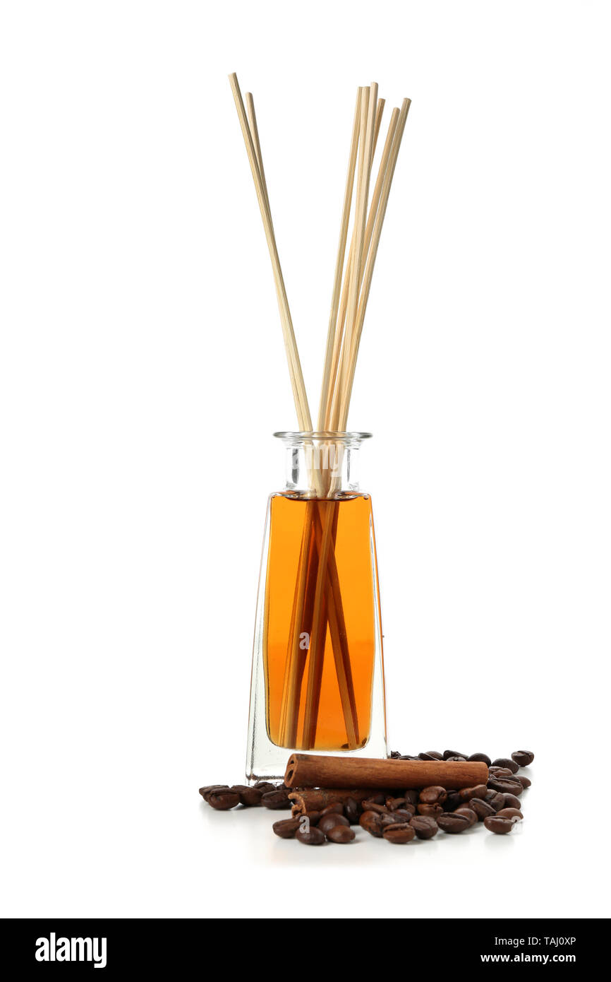 Reed diffuser, coffee beans and cinnamon on white background Stock Photo