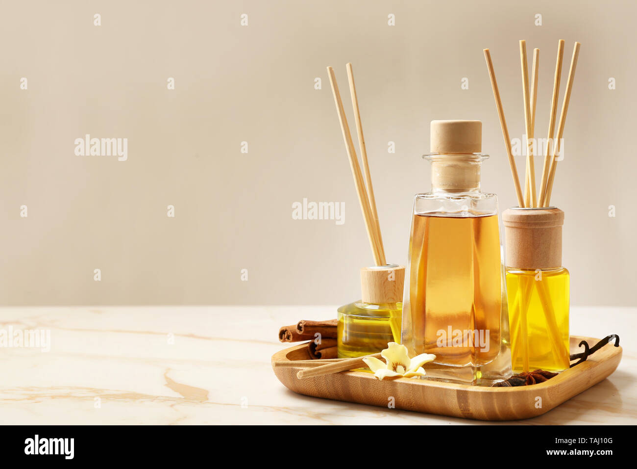 Different reed diffusers on table Stock Photo - Alamy