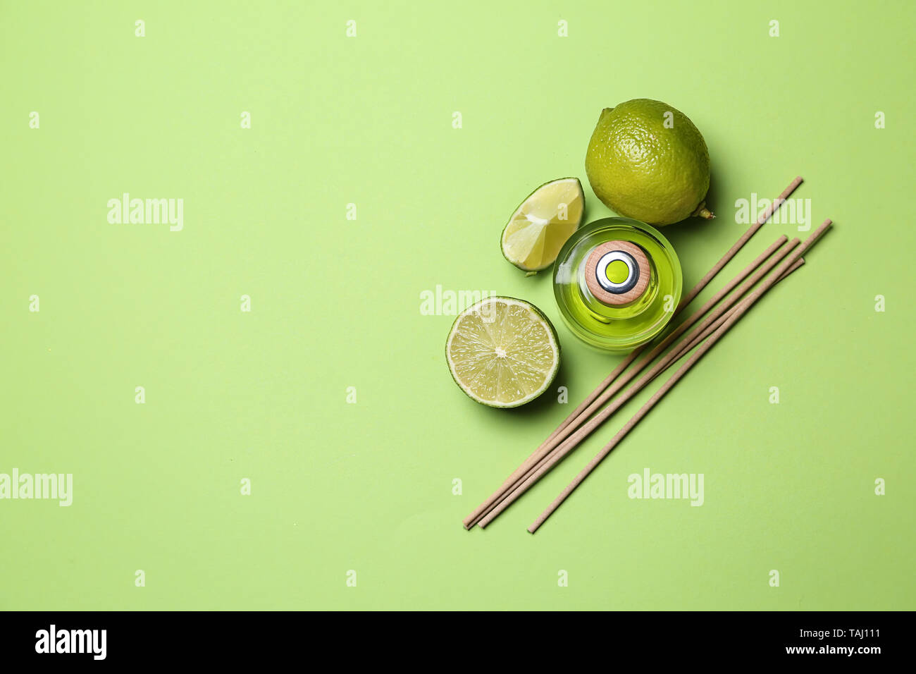 Citrus reed diffuser on color background Stock Photo