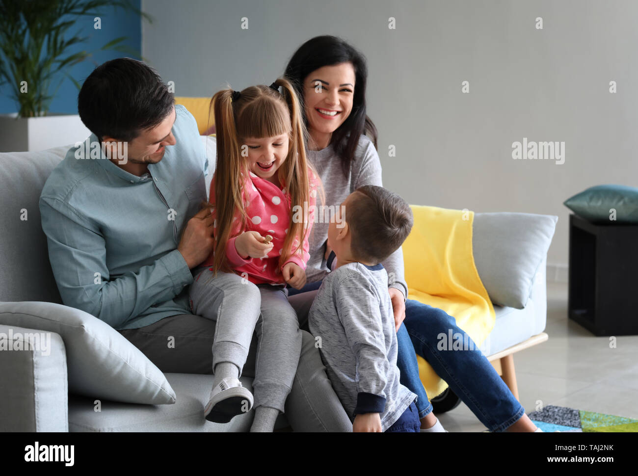 Happy family spending time at home Stock Photo