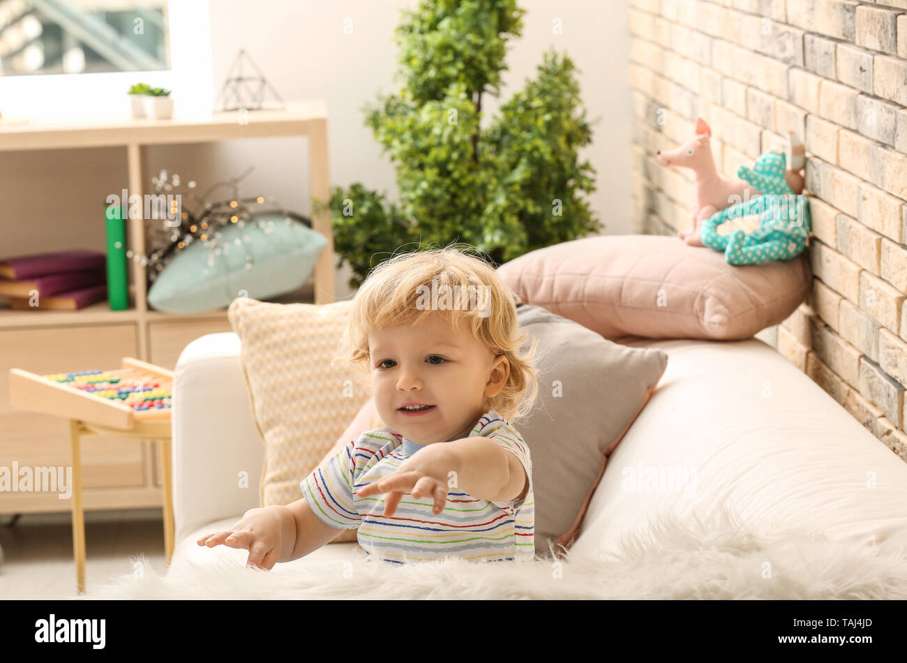 Portrait of cute little boy at home Stock Photo - Alamy