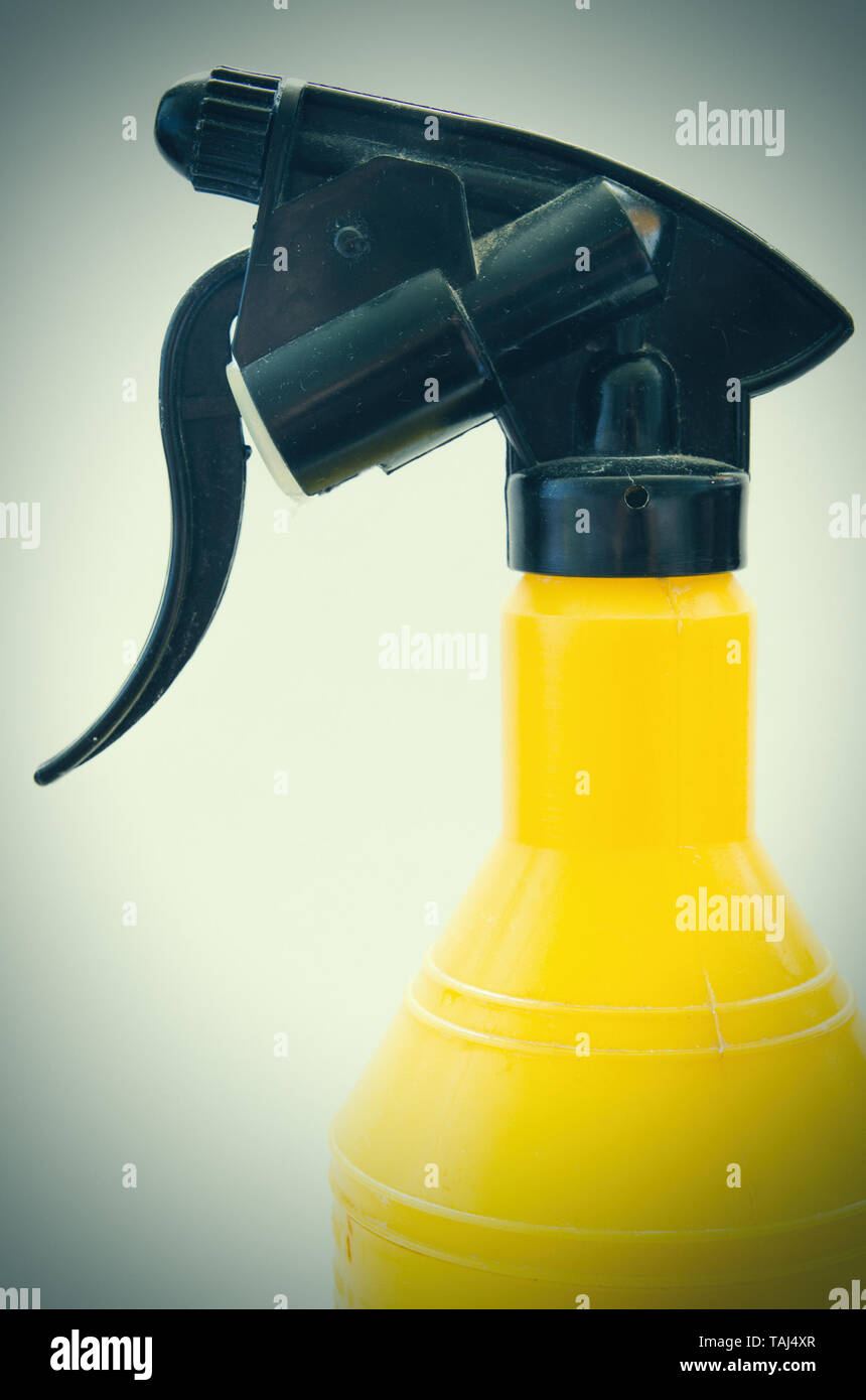 yellow water sprayer with black trigger Stock Photo