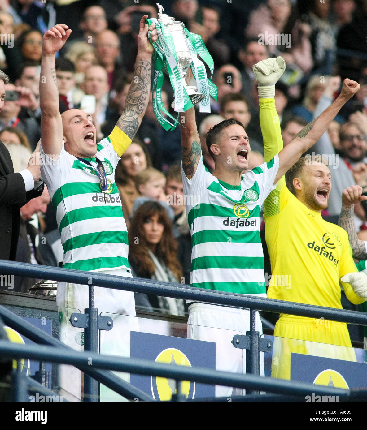 Glasgow, Scotland, May 25th 2019. Scott Brown of Celtic and Mikael Lustig of Celtic lift the Scottish cup after the William Hill Scottish Cup final between Celtic and Hearts at Hampden Park on May 25th 2019 in Glasgow, Scotland. Editorial use only, licence required for commercial use. No use in Betting, games or a single club/league/player publication. Credit: Scottish Borders Media/Alamy Live News Stock Photo