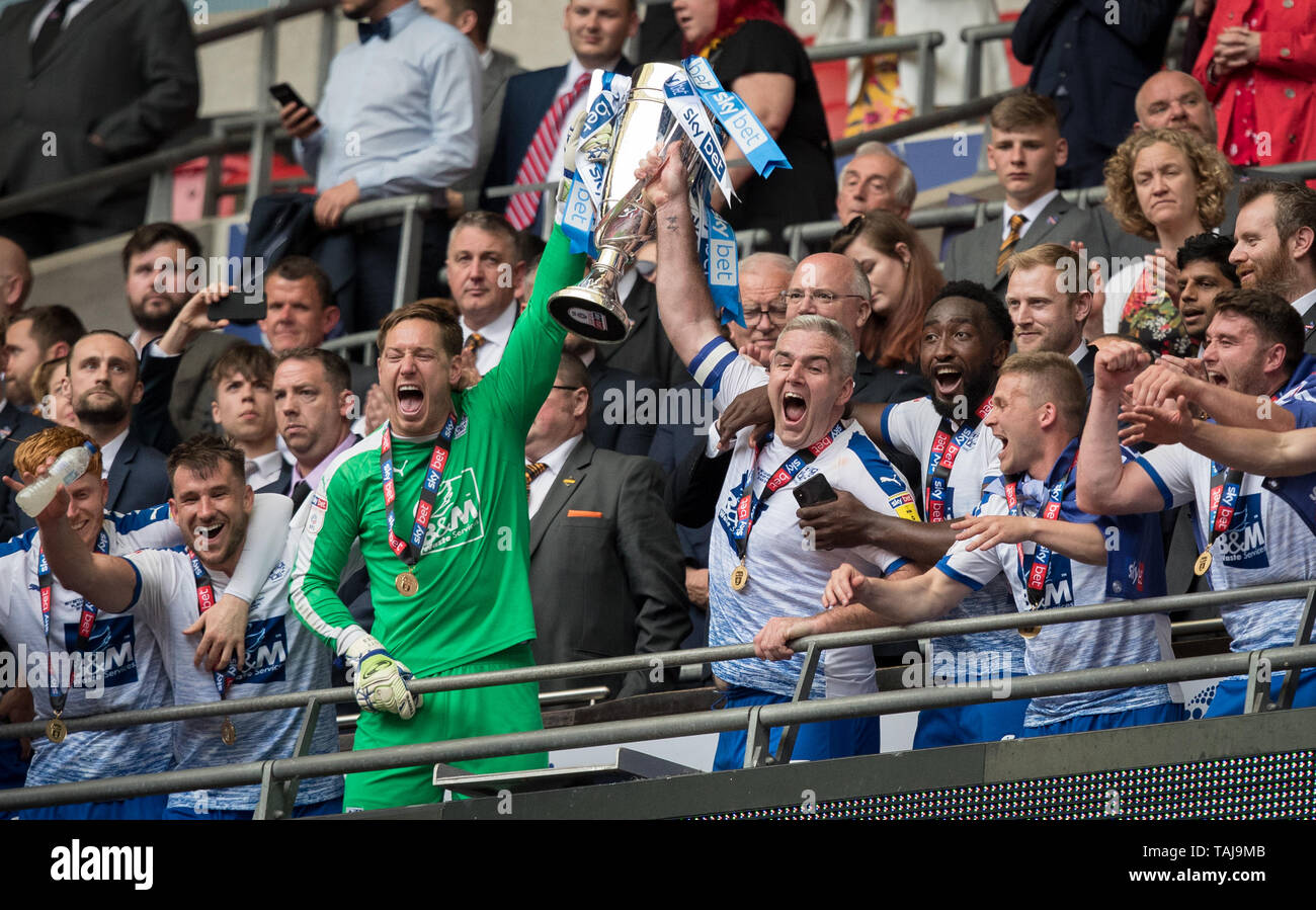 London, UK. 25th May, 2019. Goalkeeper Scott Davies & Steve McNulty of Tranmere Rovers lift the trophy during the Sky Bet League 2 Play-Off FINAL match between Newport County and Tranmere Rovers at Wembley Stadium, London, England on 25 May 2019. Photo by Andy Rowland. Credit: PRiME Media Images/Alamy Live News Stock Photo