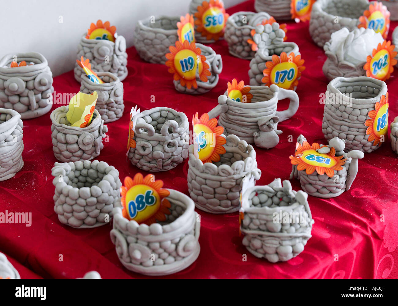 Cixi. 25th May, 2019. Photo taken on May 25, 2019 shows the pottery wares made by pupils in Cixi City, east China's Zhejiang Province. A volunteer center in Cixi City opened a pottery class for local pupils in celebration of the upcoming International Children's Day. Credit: Xu Yu/Xinhua/Alamy Live News Stock Photo