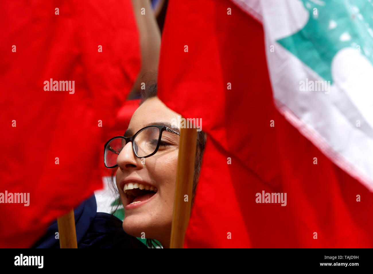 Beirut. 24th May, 2019. A woman attends a protest in the downtown of Beirut, Lebanon, May 24, 2019, refusing to reduce the budget of the university within the policy of the government's drafted austerity budget. Credit: Bilal Jawich/Xinhua/Alamy Live News Stock Photo