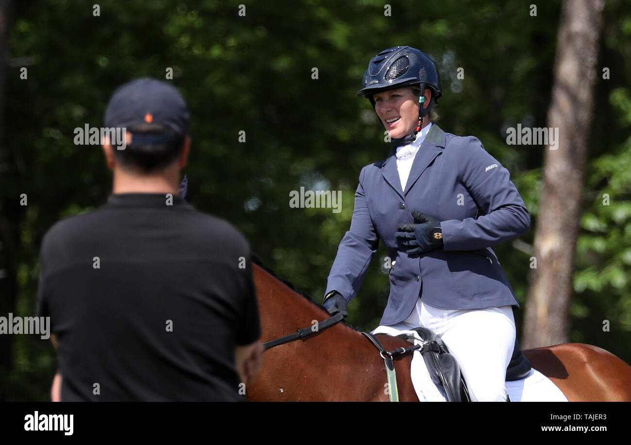 Houghton, UK. 25th May, 2019. Zara Tindall places her hand on her chest,  after she fell from an earlier ride, before she put Watkins through the  showjumping stage at the Saracen Horse