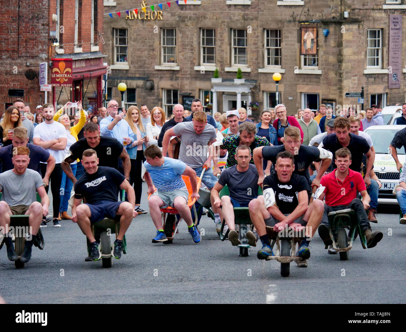 News UK: Wirksworth wheelbarrow race, 25th May 2019 Derbyshire Dales, Peak District, Derbyshire, England, UK Stock Photo