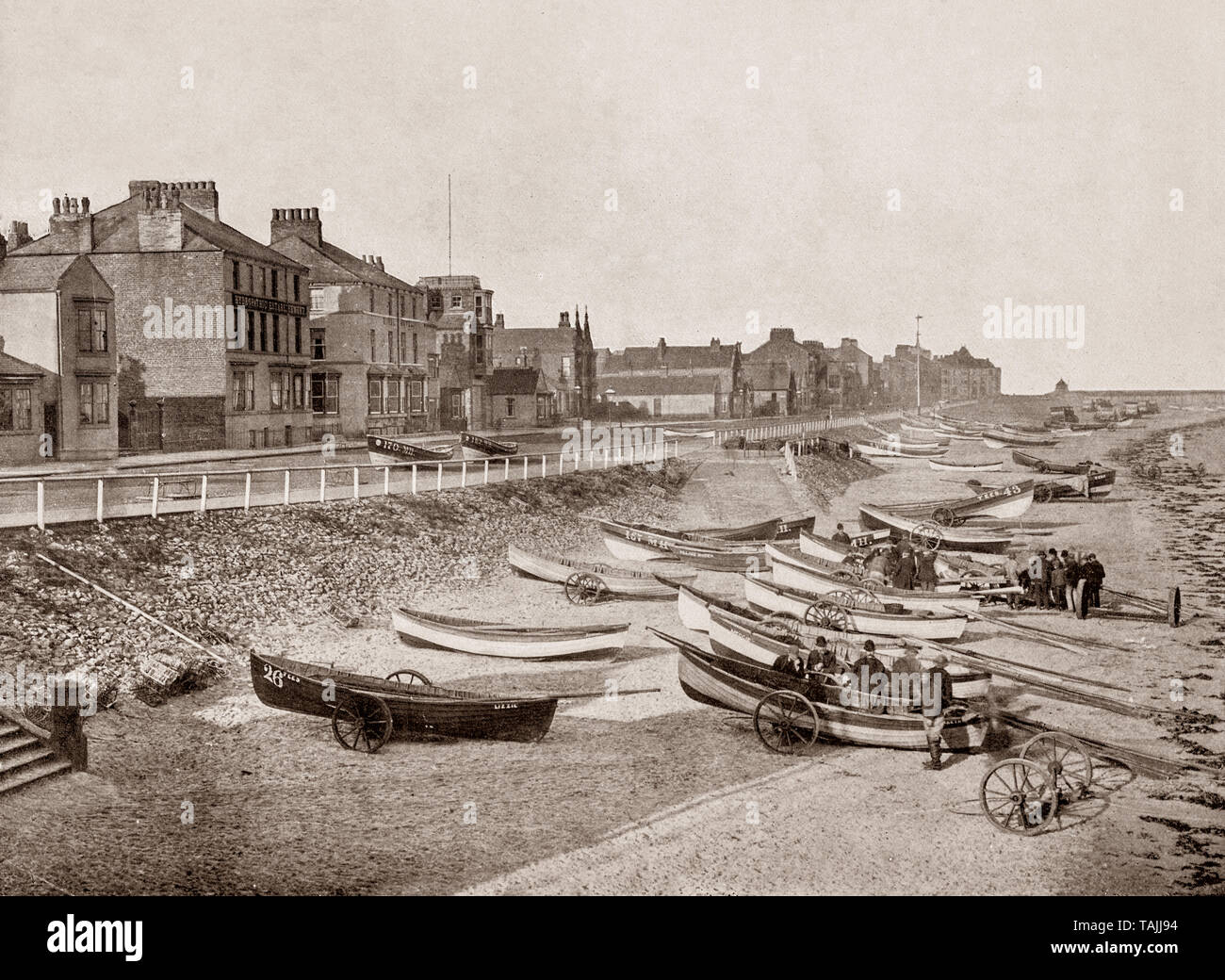 A late 19th Century view of the beach with fishermen and their boats at ...