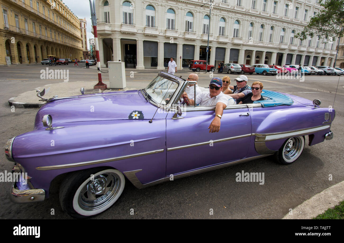 Havana, Cuba - A taxi stops in front of Hotel Parque Central (Central Park). Classic American cars from the 1950s, imported before the U.S. embargo, a Stock Photo