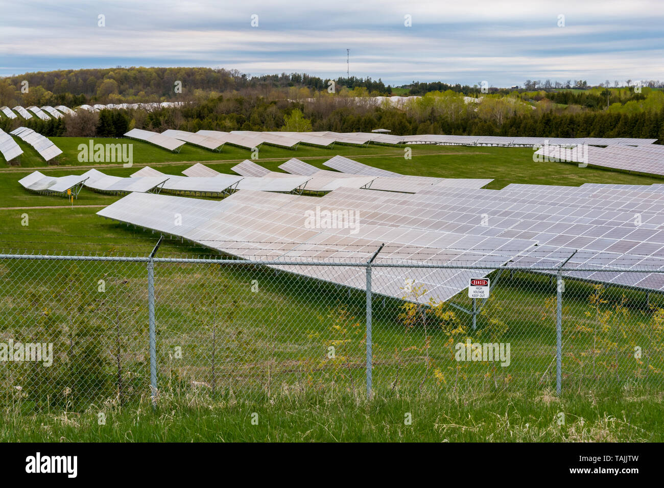 Solar farm featuring array of several solar panels Stock Photo