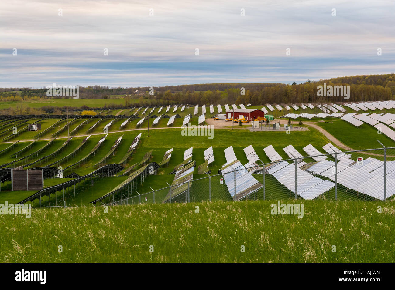 Solar farm featuring array of several solar panels Stock Photo