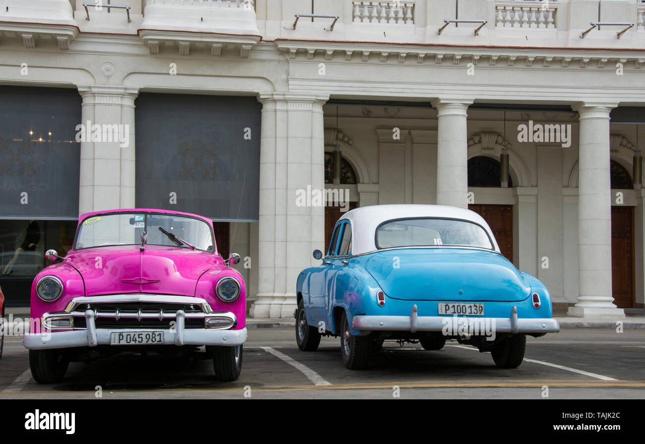 Havana, Cuba - Taxis wait for fares near Parque Central. Classic American cars from the 1950s, imported before the U.S. embargo, are commonly used as  Stock Photo