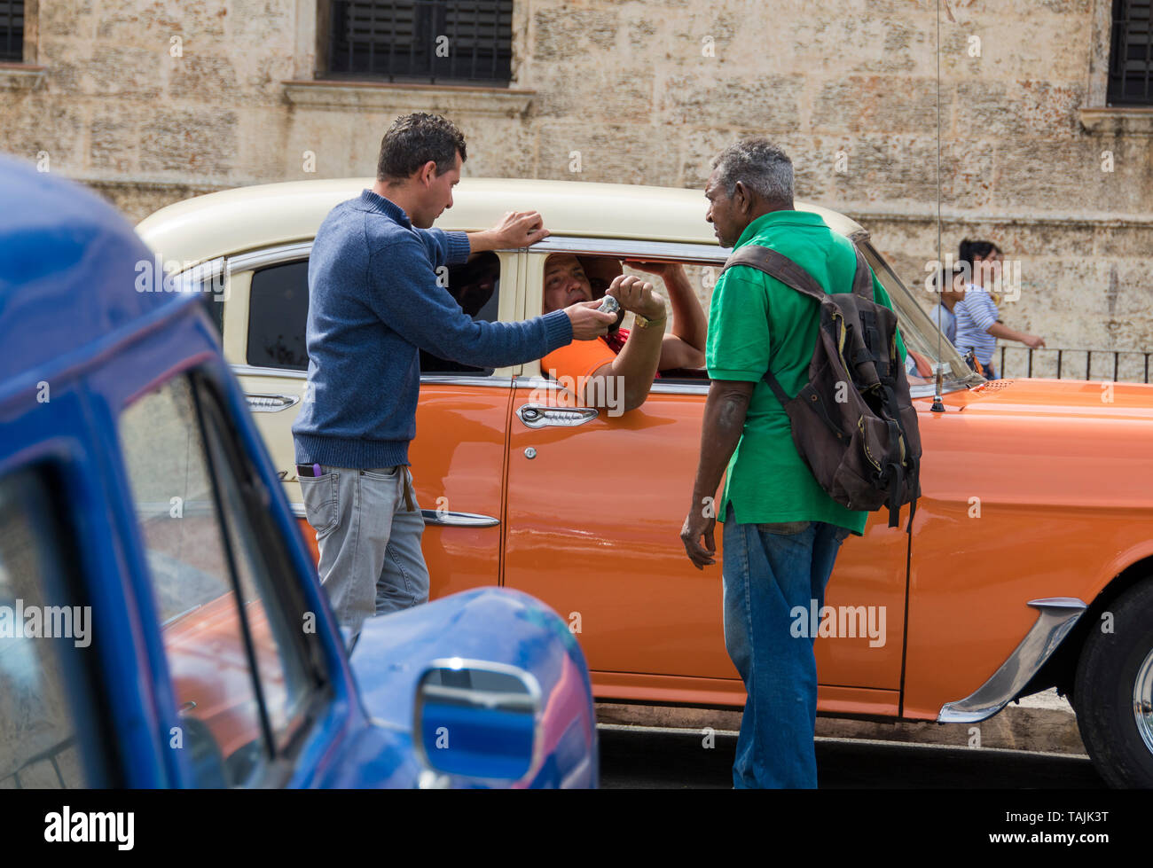 Havana, Cuba - Taxis wait for fares near Plaza de la Catedral. Classic American cars from the 1950s, imported before the U.S. embargo, are commonly us Stock Photo