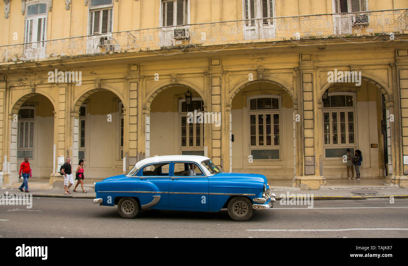 Havana, Cuba - A taxi drives on Paseo de Martí near Parque Central (Central Park). Classic American cars from the 1950s, imported before the U.S. emba Stock Photo