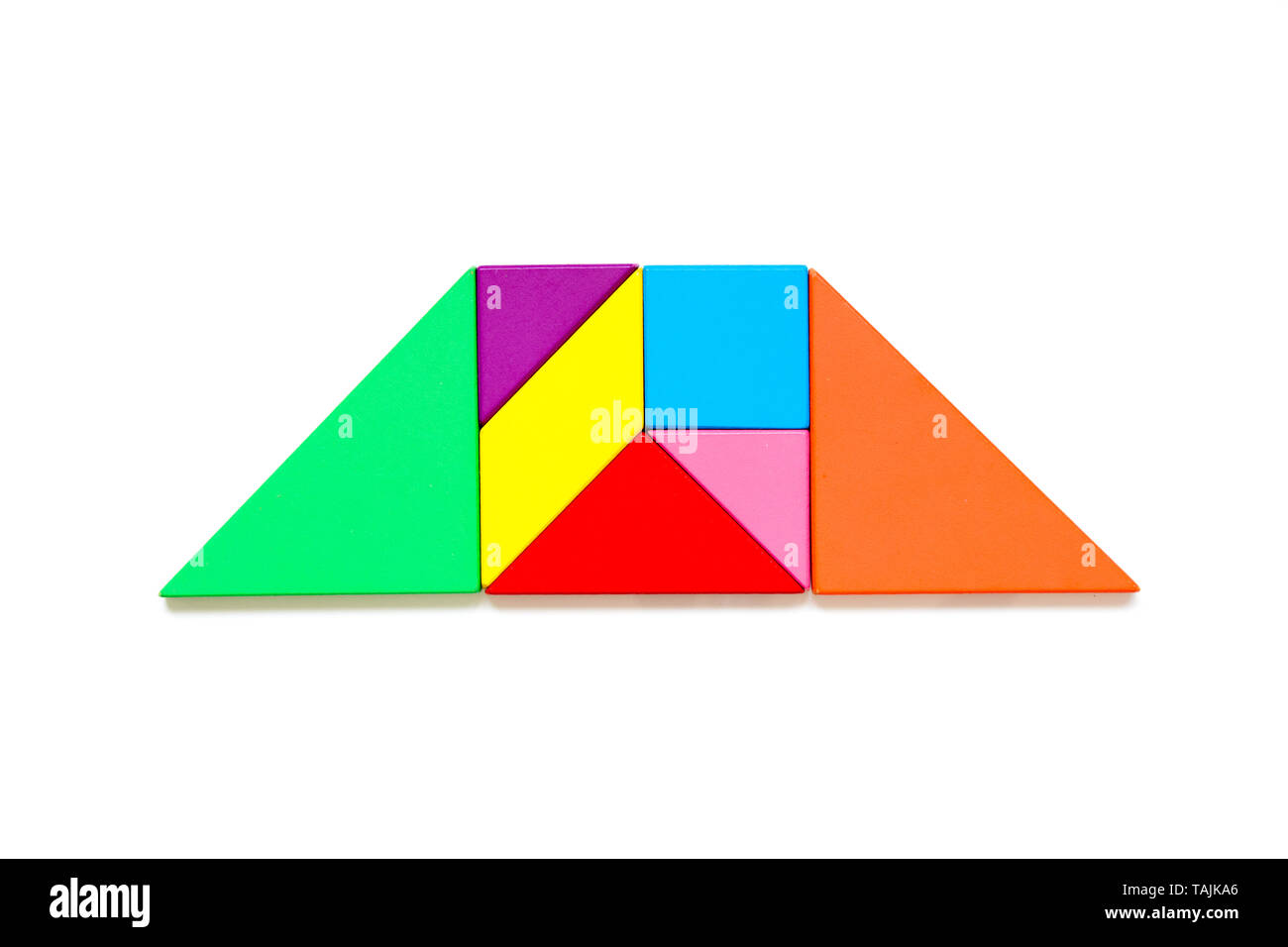 Color wood tangram puzzle in trapezoid shape on white background Stock