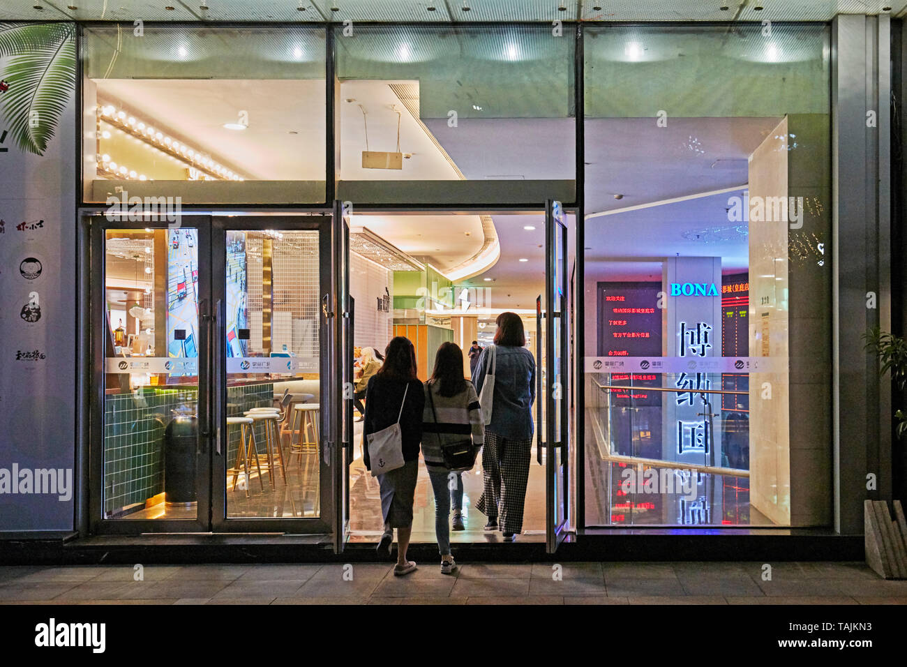 Three women walking into a restaurant at Wongtee Plaza shopping mall