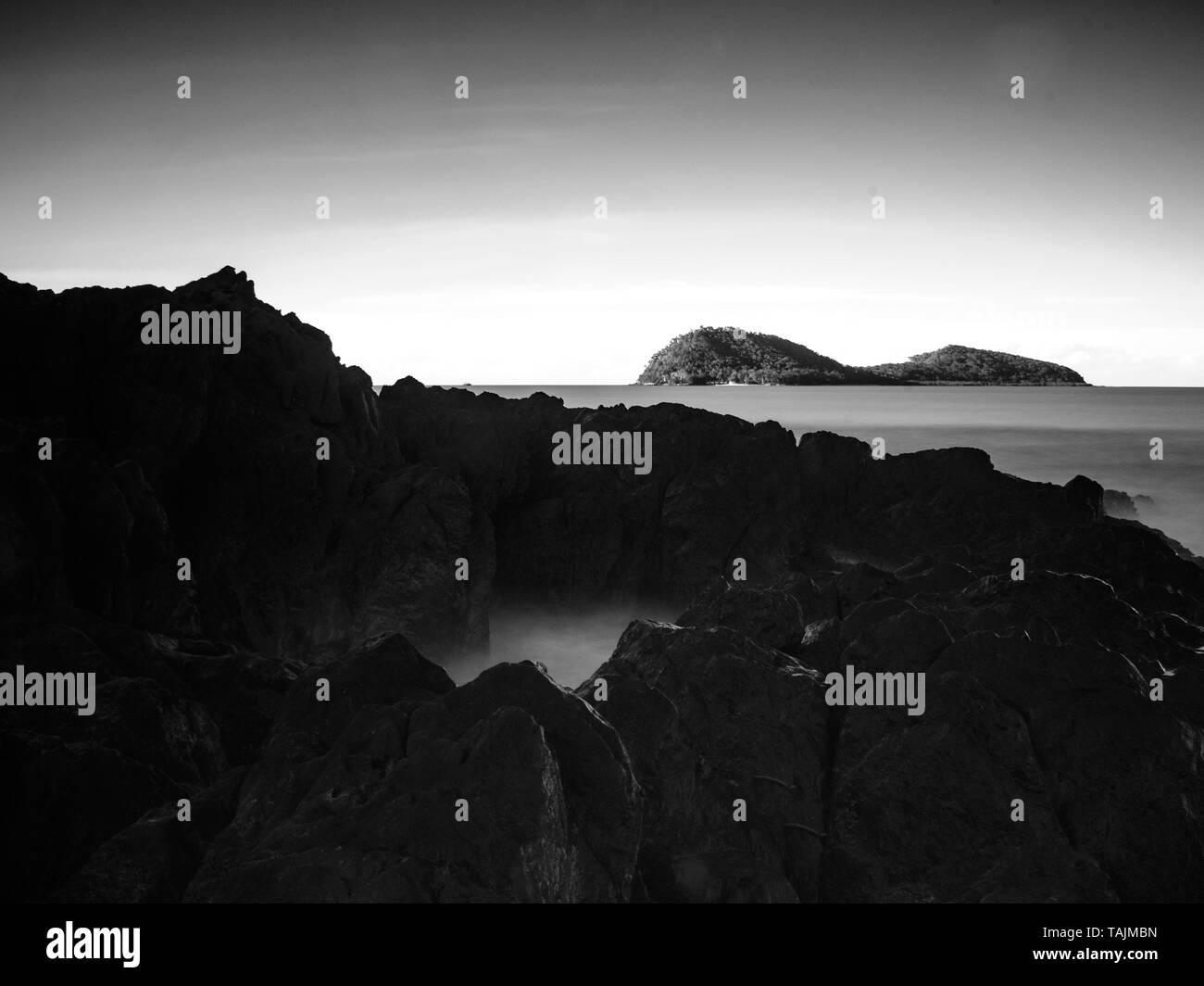 Double Island over rocks Palm Cove Queensland Australia Stock Photo