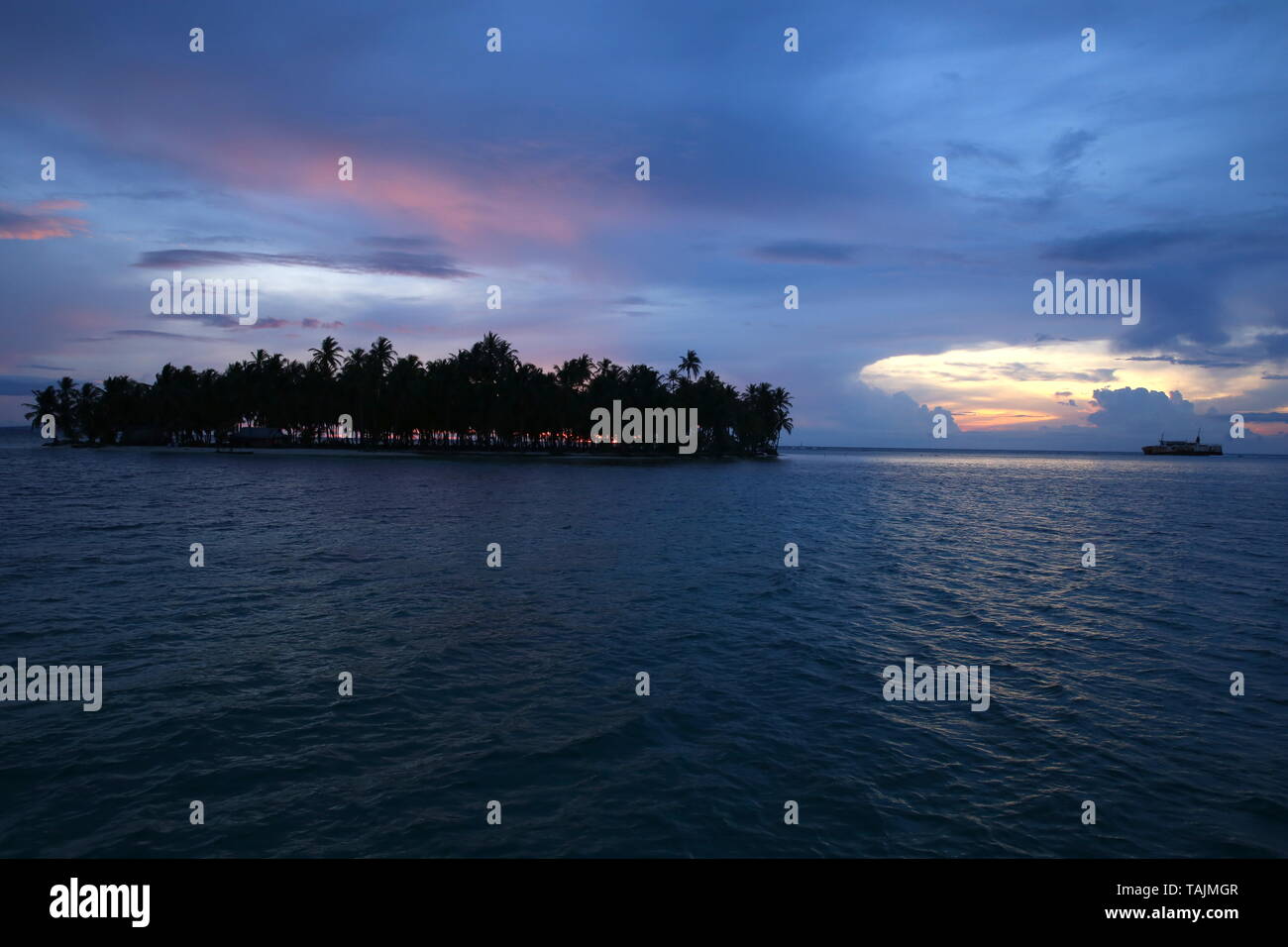A calm dusk just off Isla Chichime in the San Blas Islands of Panama Stock Photo