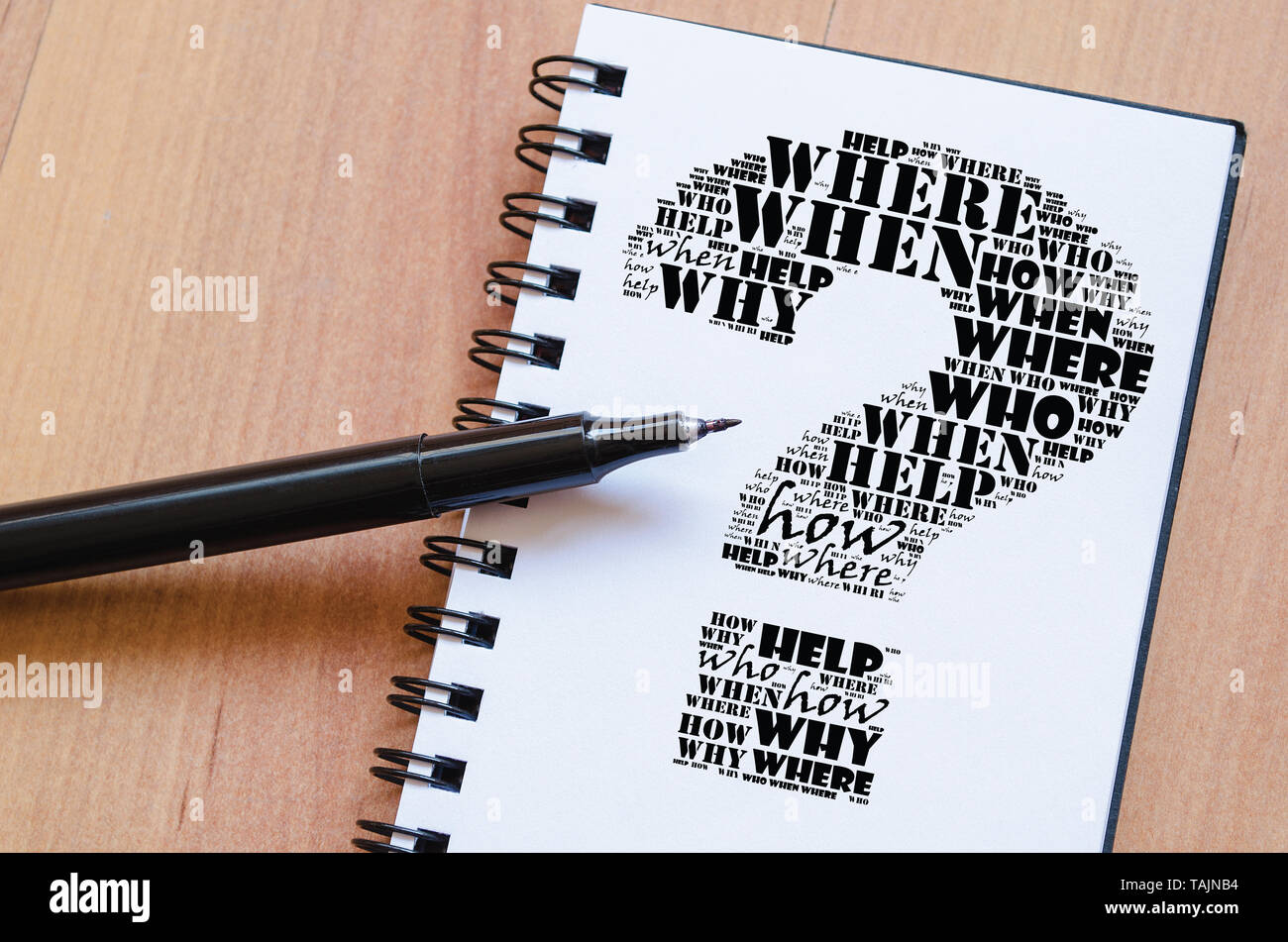 Question mark word cloud collage over notepad background Stock Photo