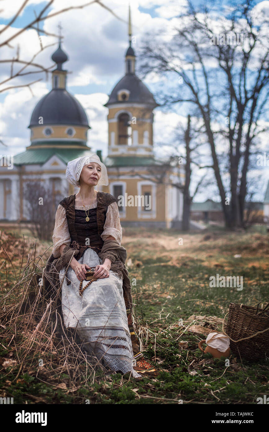 an elderly woman in medieval outfits outdoors Stock Photo - Alamy