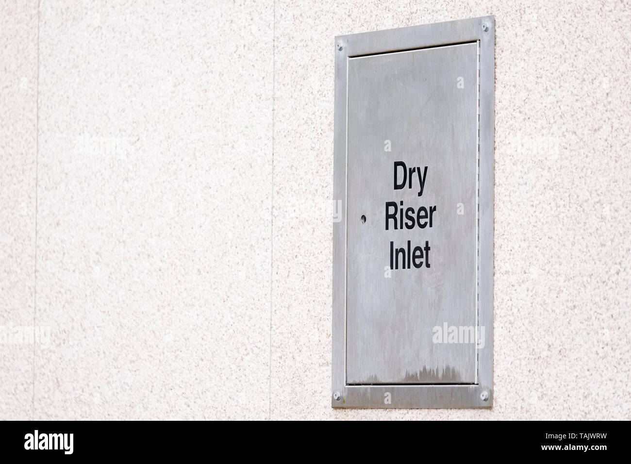 Dry riser steel silver box architrave on building wall Stock Photo Alamy