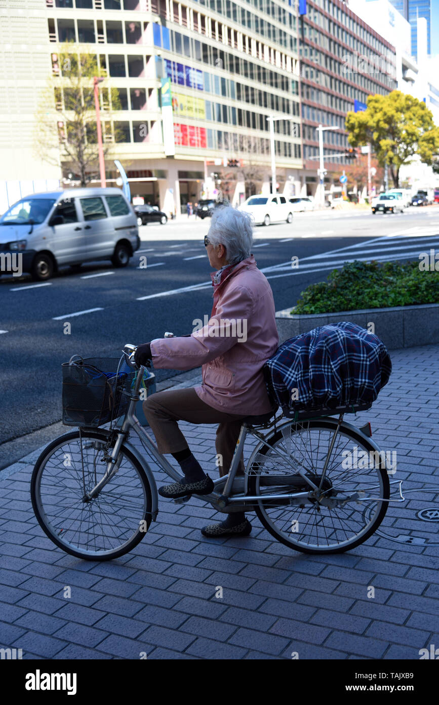 Elderly Lady on bicycle japan Stock Photo Alamy