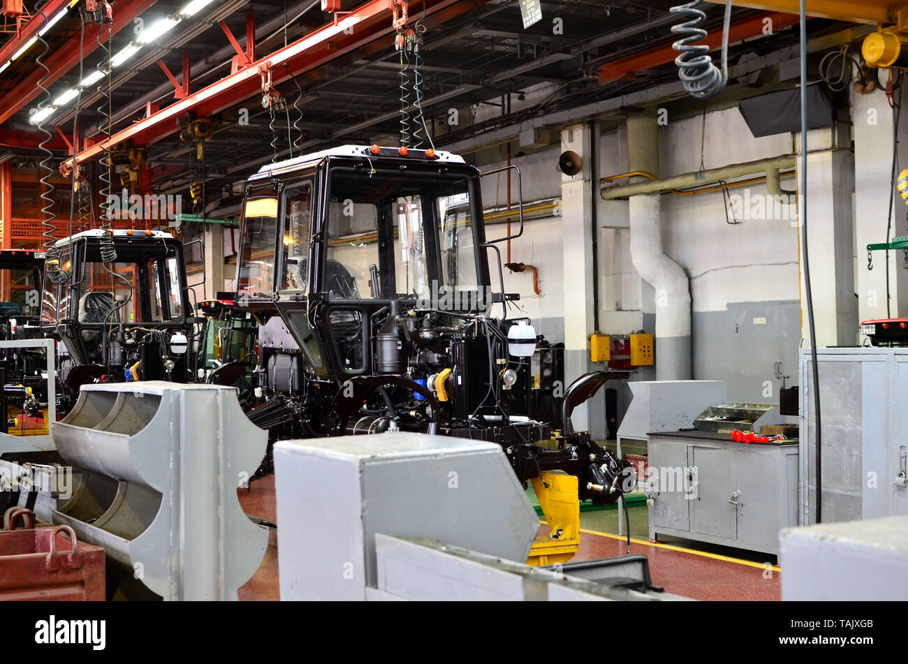 Tractor Manufacture work. Assembly line inside the agricultural