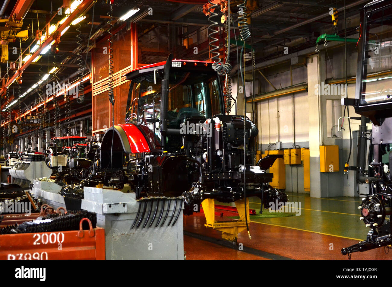 Tractor Manufacture work. Assembly line inside the agricultural
