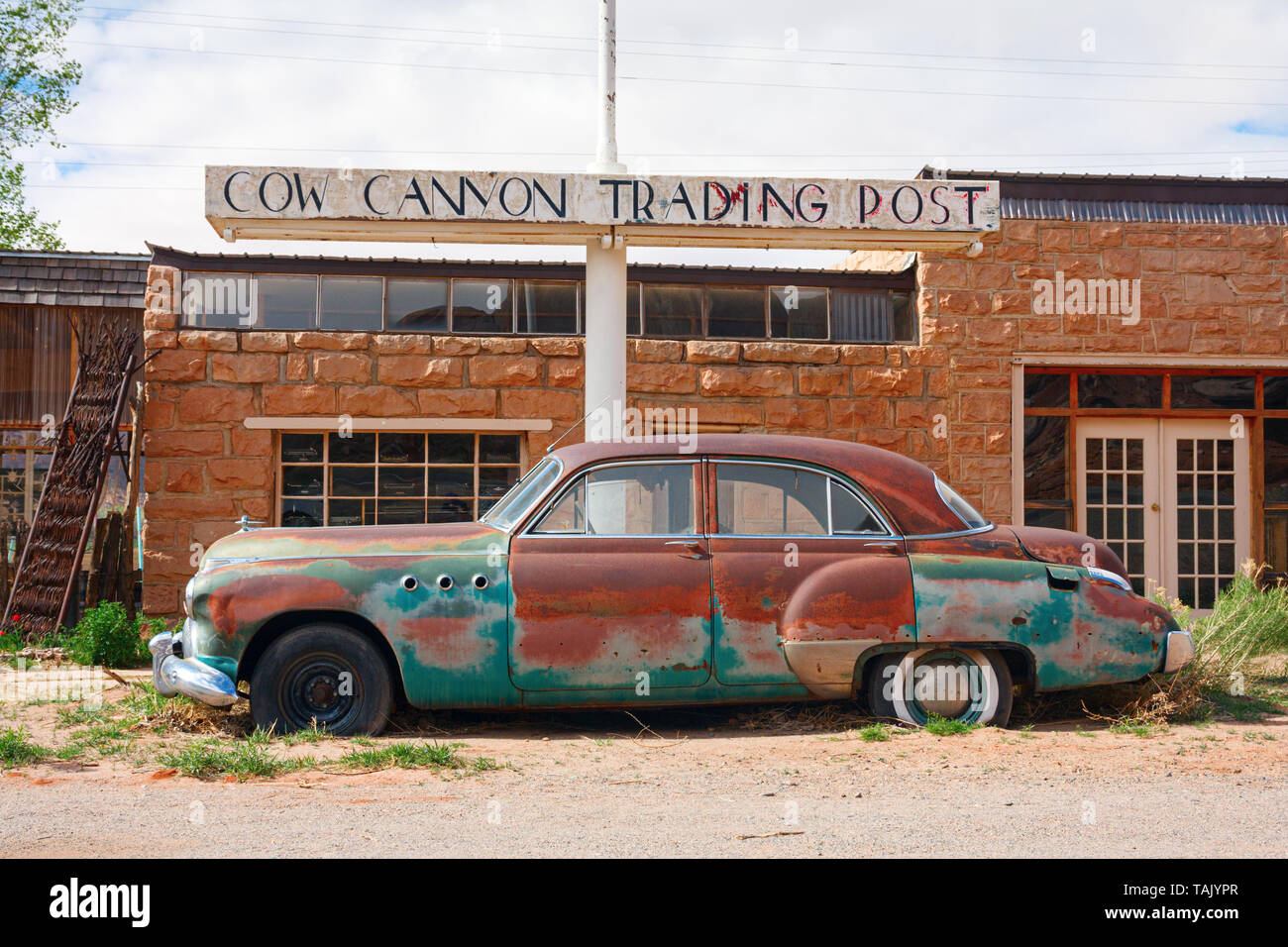 BLUFF, UTAH, USA - APRIL 17, 2013: Old, rusty 1949 Buick Super car parked in front of the Cow Canyon Trading Post building along the U.S. Route 191 un Stock Photo
